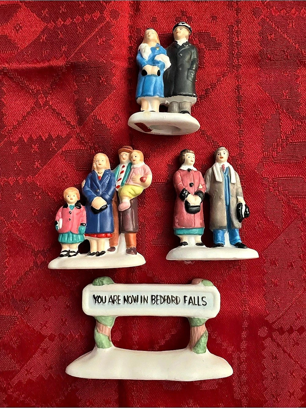 Christmas village people and Welcome Sign. from It’s A Wonderful Life